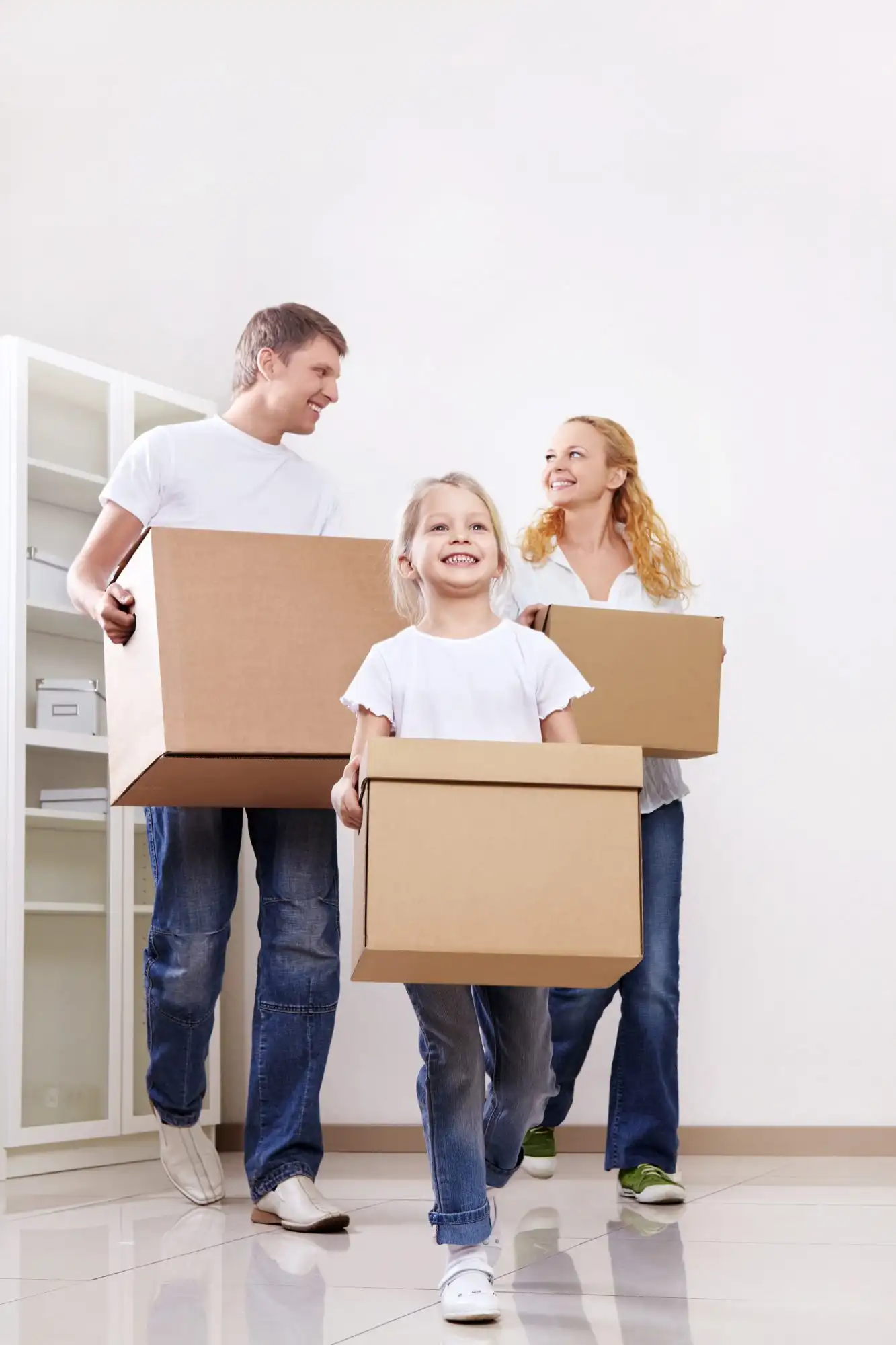 A couple with moving boxes in a living room