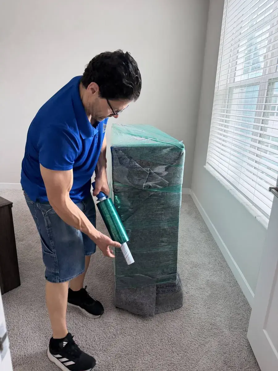 Toro Movers stretch-wrapping furniture on a real labor-only job