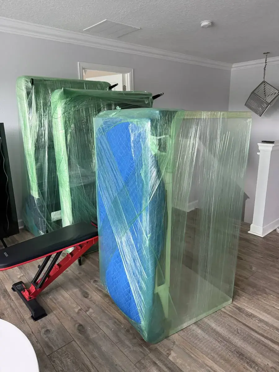 Furniture fully stretch-wrapped and padded before a local move